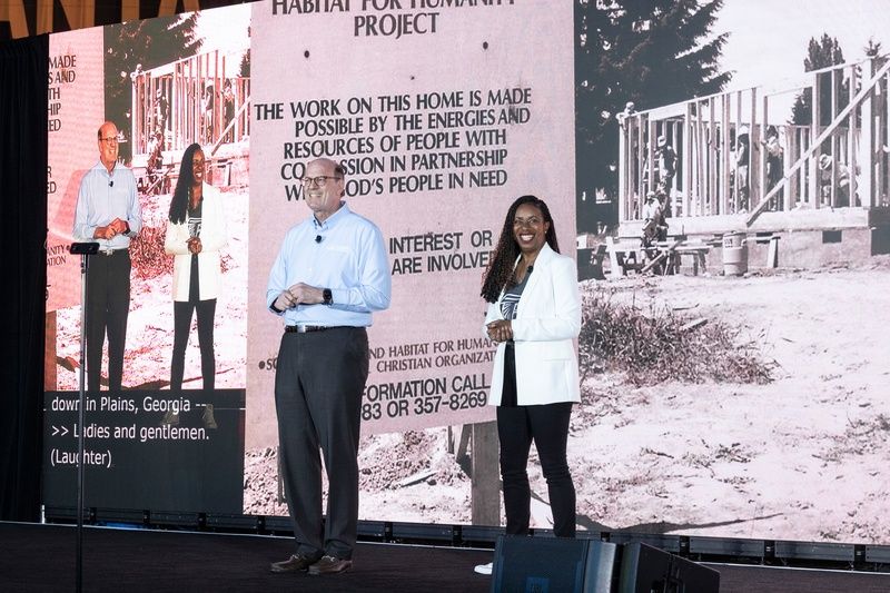 Two speakers on stage during the 2026 Carter Work Project opening ceremony